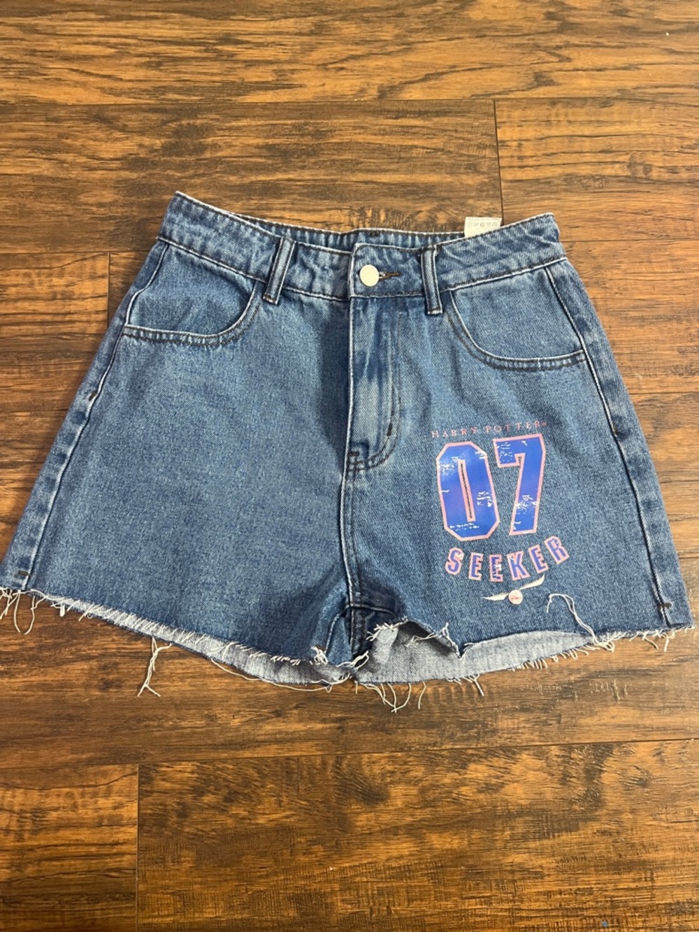 SHEIN Blue High-Rise Frayed Denim Shorts with '07 Seeker' Graphic